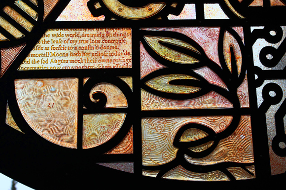 Detail of cast glass - fibonacci spiral, seedling and text